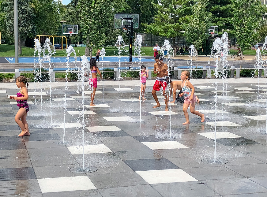 Kids playing at water splash pad.